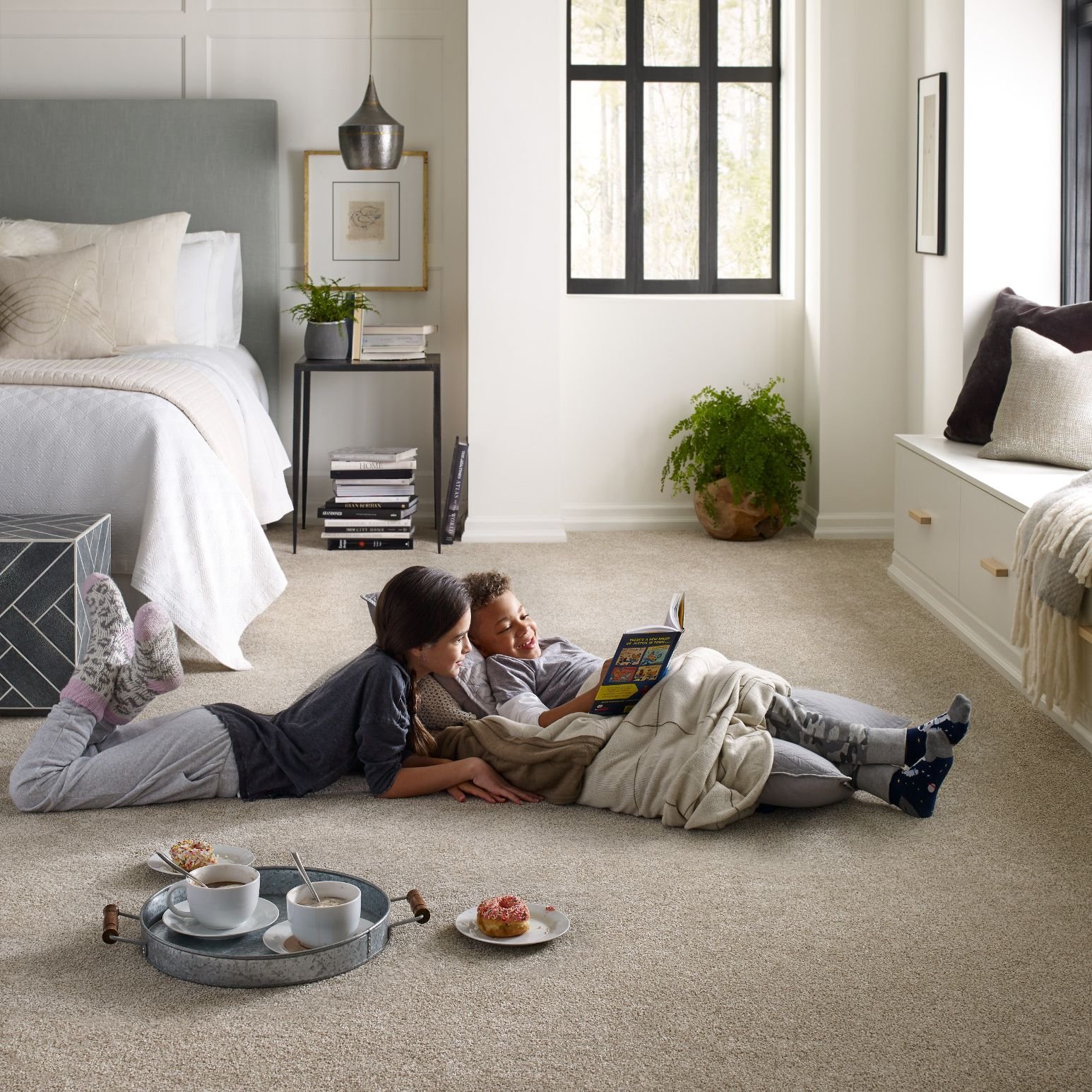 Kids reading on the beige carpet floor from Eastern Floor Covering in Virginia area
