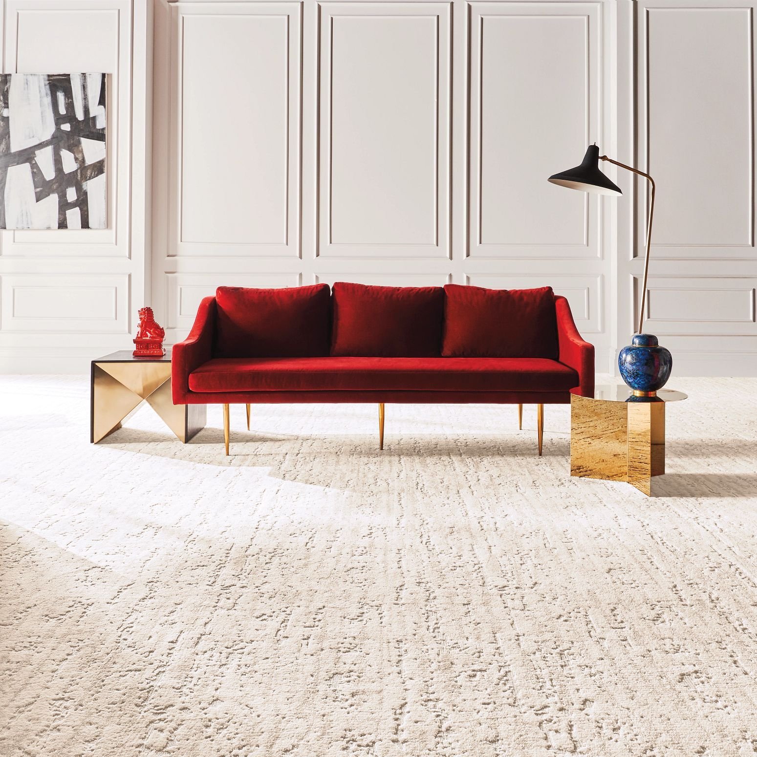 Living room with red couch and white nylon carpet from Eastern Floor Covering in Virginia area